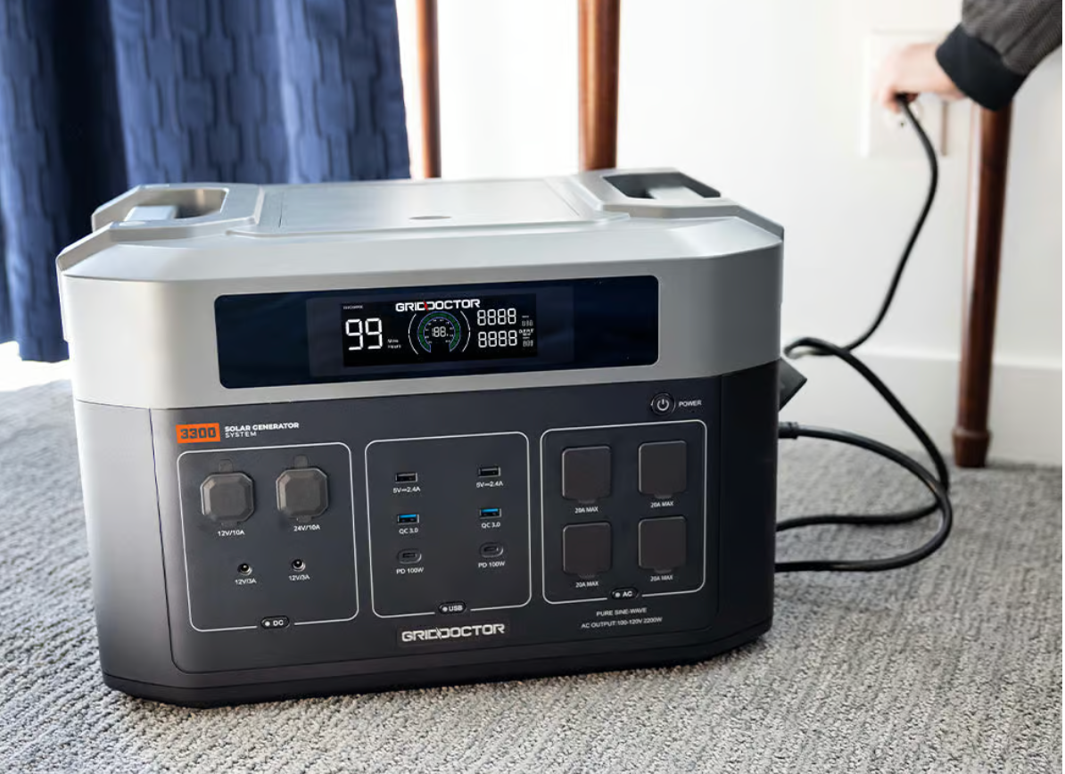 An indoor generator sitting on the floor in a house.