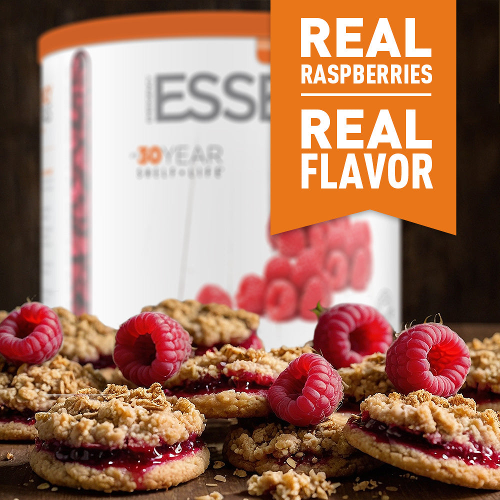 Cookies with raspberries in front of can packaging