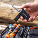 Person using the Pocket Plasma Lighter from the InstaFire Tactical Fire Starting Kit outdoors.