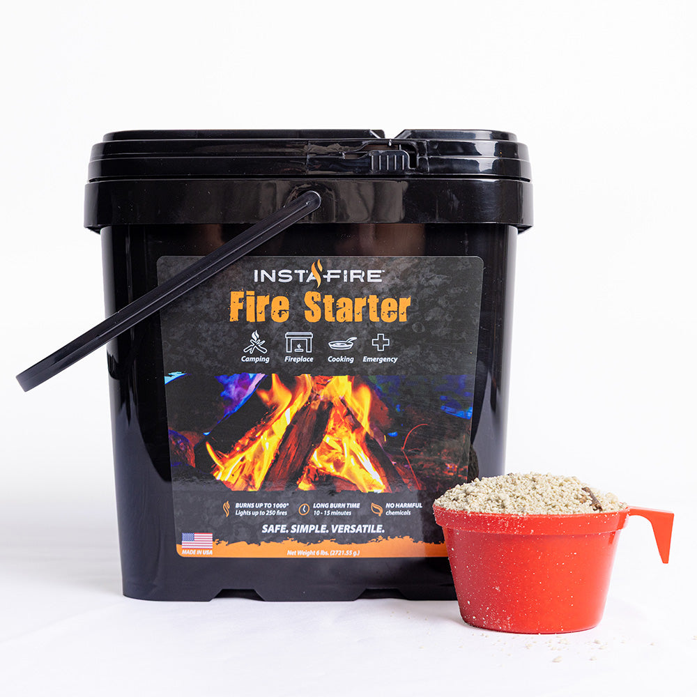 InstaFire Fire Starter & Fuel 2-gallon bucket with orange scoop filled with fire starter granules on a white background.