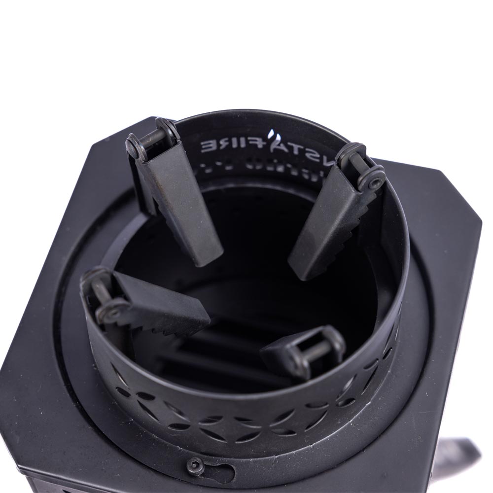 Close up of the InstaFire Inferno Outdoor Biomass Stove with prongs folded in on a white background
