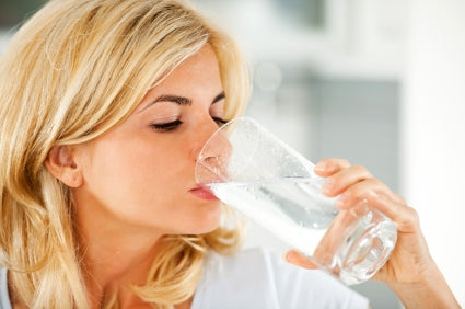 iStock_000016955692XSmall_Blonde_Woman_Drinks_Water