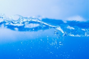 Bubbles breaking the surface of water