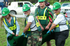 CERT Volunteers carrying an injured person