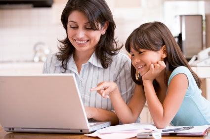 Mom and daughter on Pinterest on laptop Mom and daughter on Pinterest on laptop