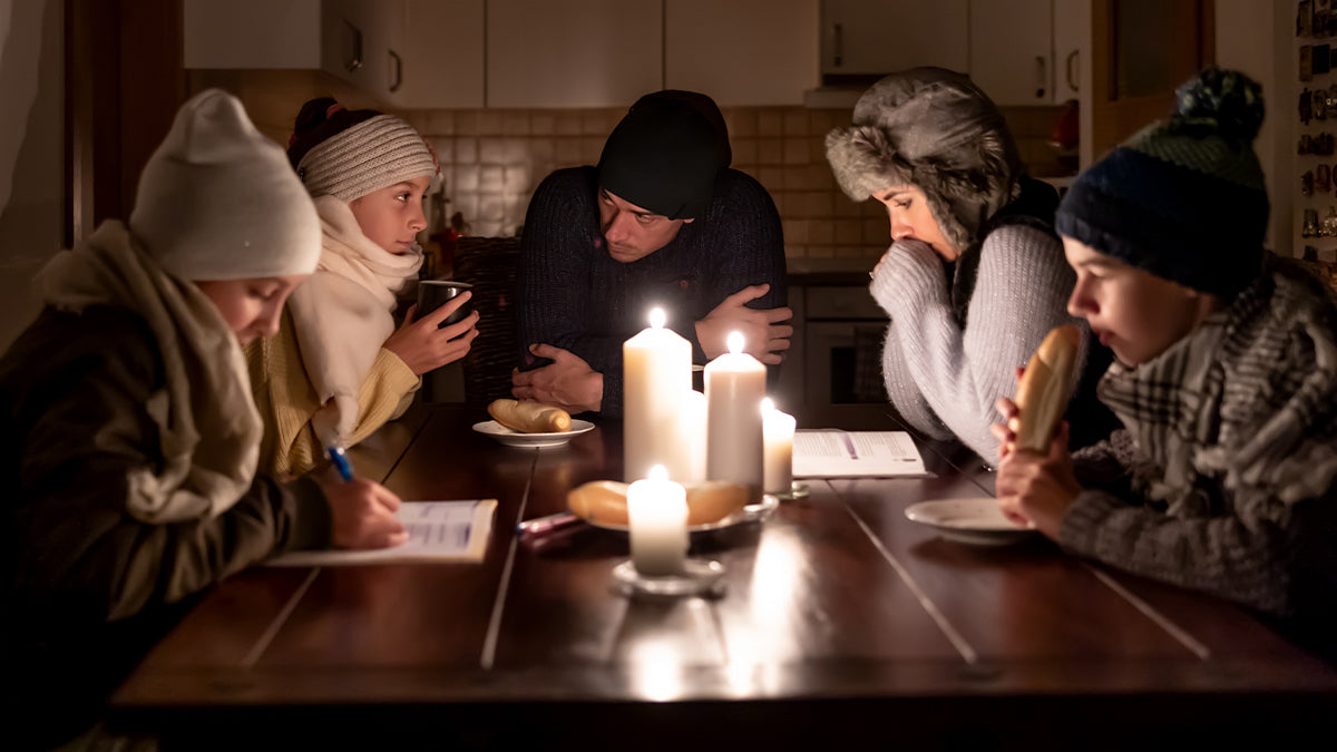 A family huddled in a storm shelter.