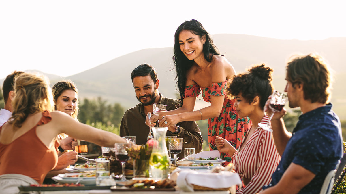 Group of people enjoying a meal outdoors
