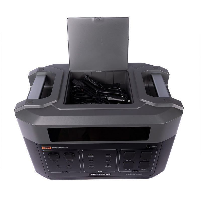 Open storage compartment on top of the Grid Doctor 2200 battery, displaying space for organizing charging cords, against a white background. (7404114083980)