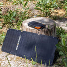 Grid Doctor portable solar charging equipment set up outdoors on grass