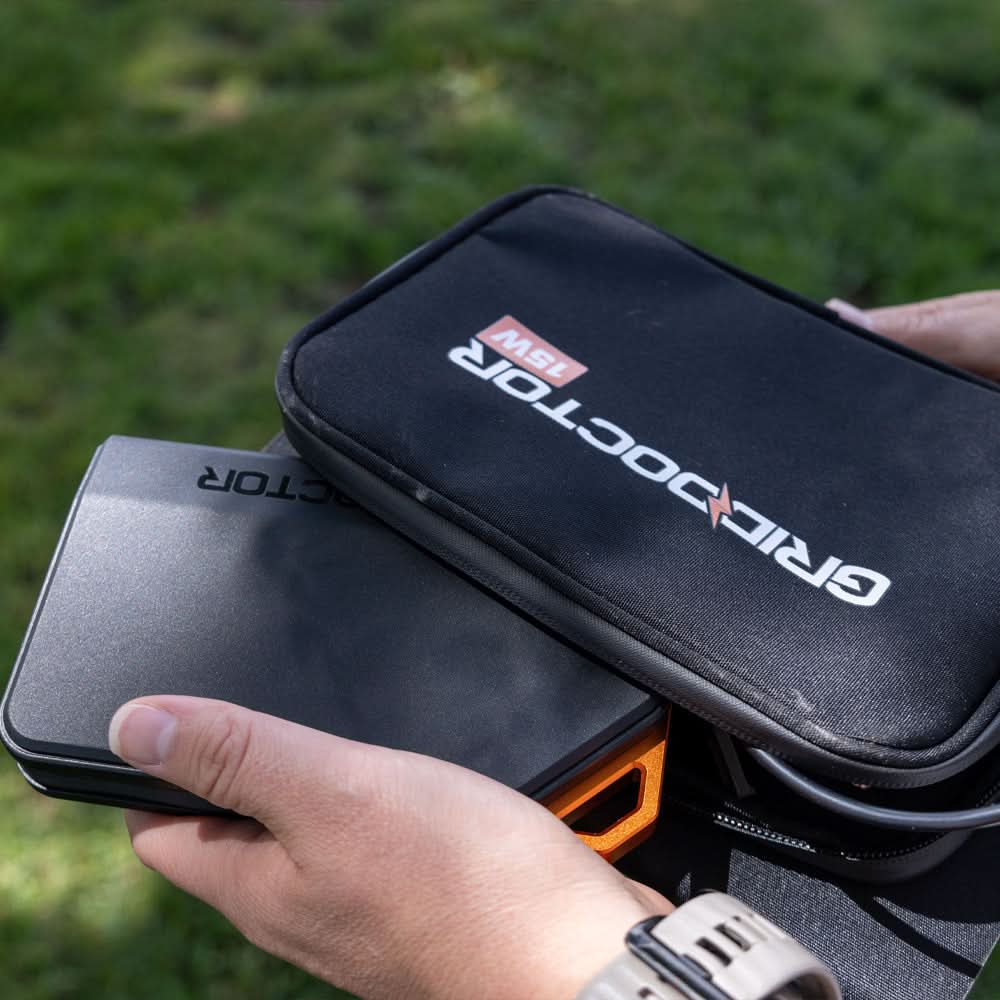 Grid Doctor 65W Power Bank and folded 15W Solar Panel being carried outdoors