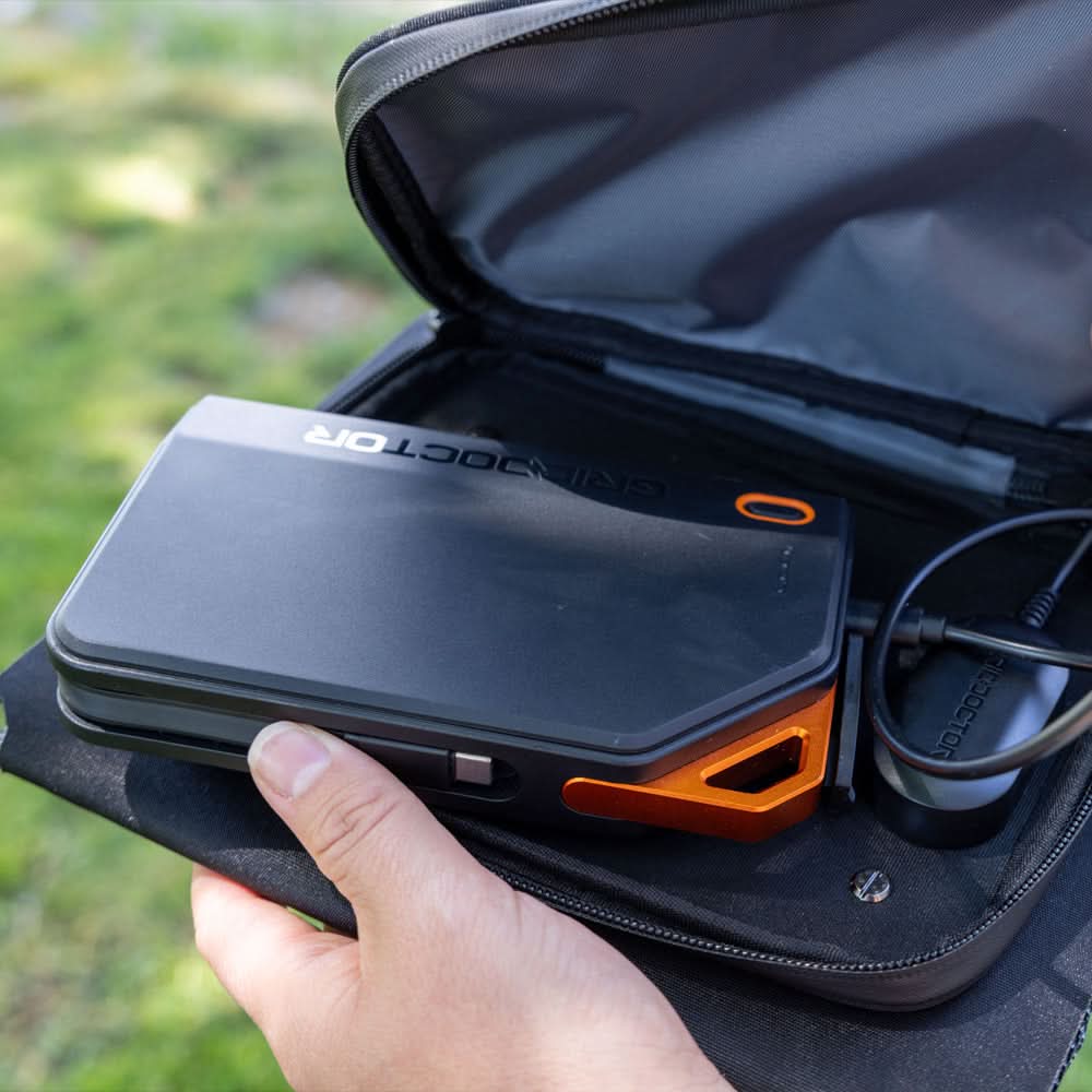 Grid Doctor 65W Power Bank being placed inside the solar panel carrying pouch