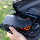 Grid Doctor 65W Power Bank being placed inside the solar panel carrying pouch