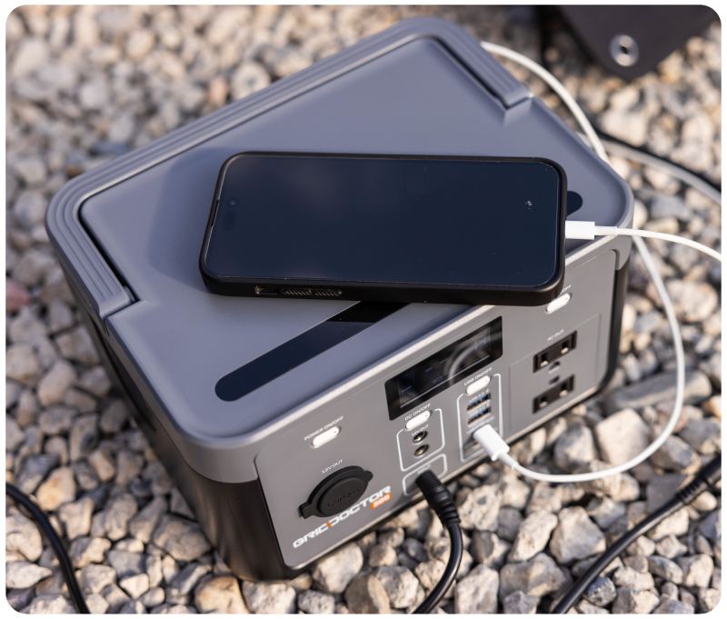 Grid Doctor 300 charging a phone outdoors