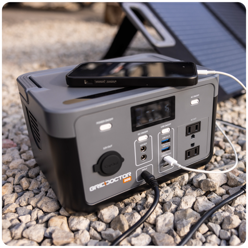 Grid Doctor 300 charging a phone outdoors