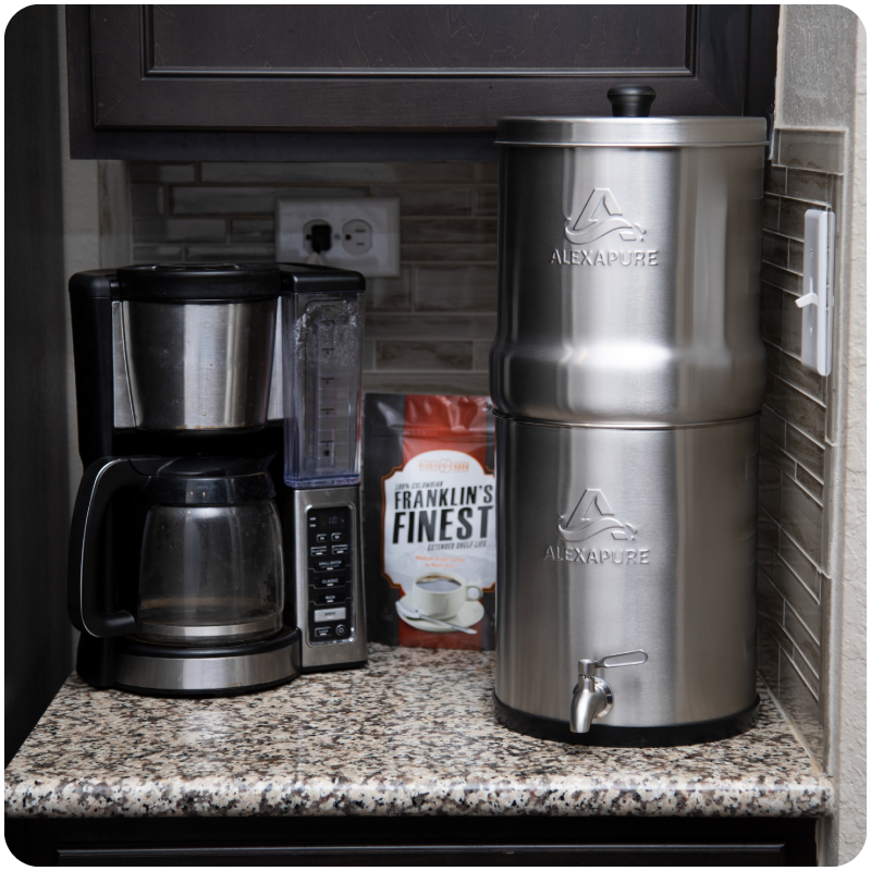 AlexaPure Pro sitting on a kitchen counter next to a coffee maker