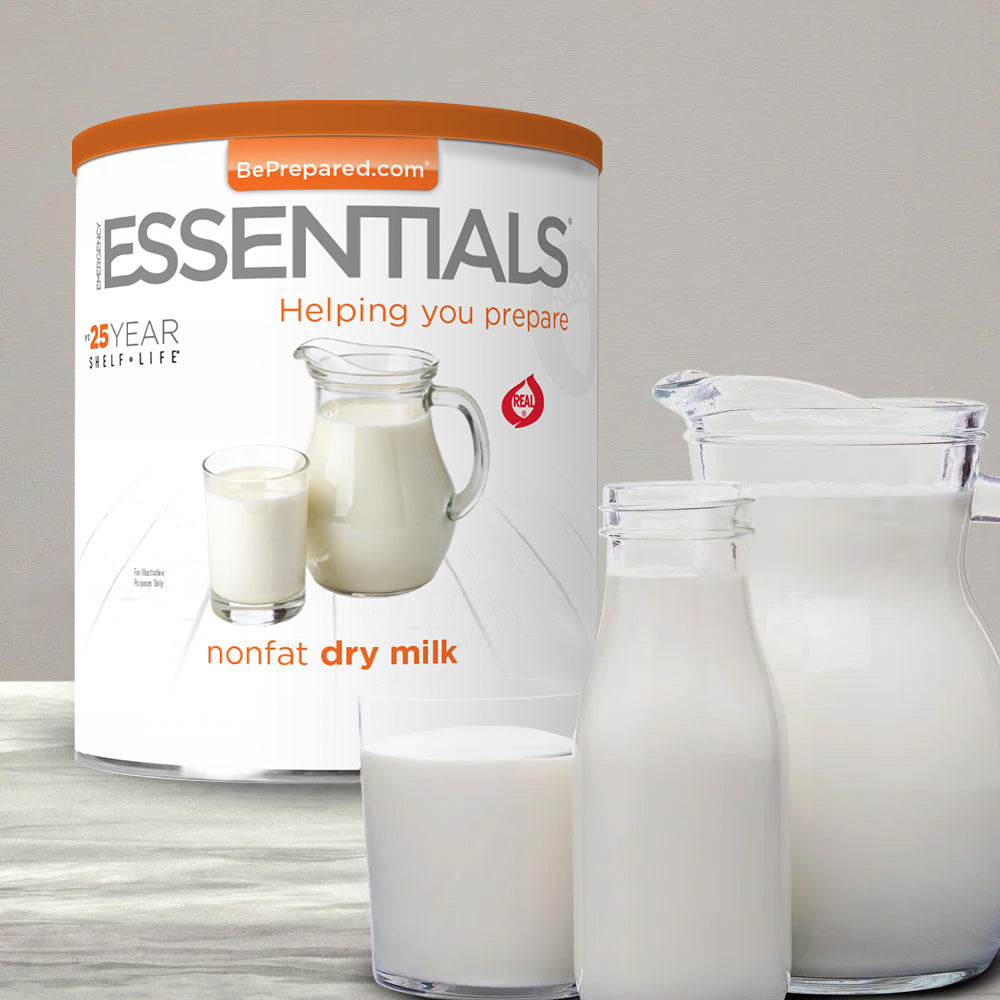 Emergency Essentials Nonfat Dry Milk #10 Can with prepared milk in a glass and pitcher