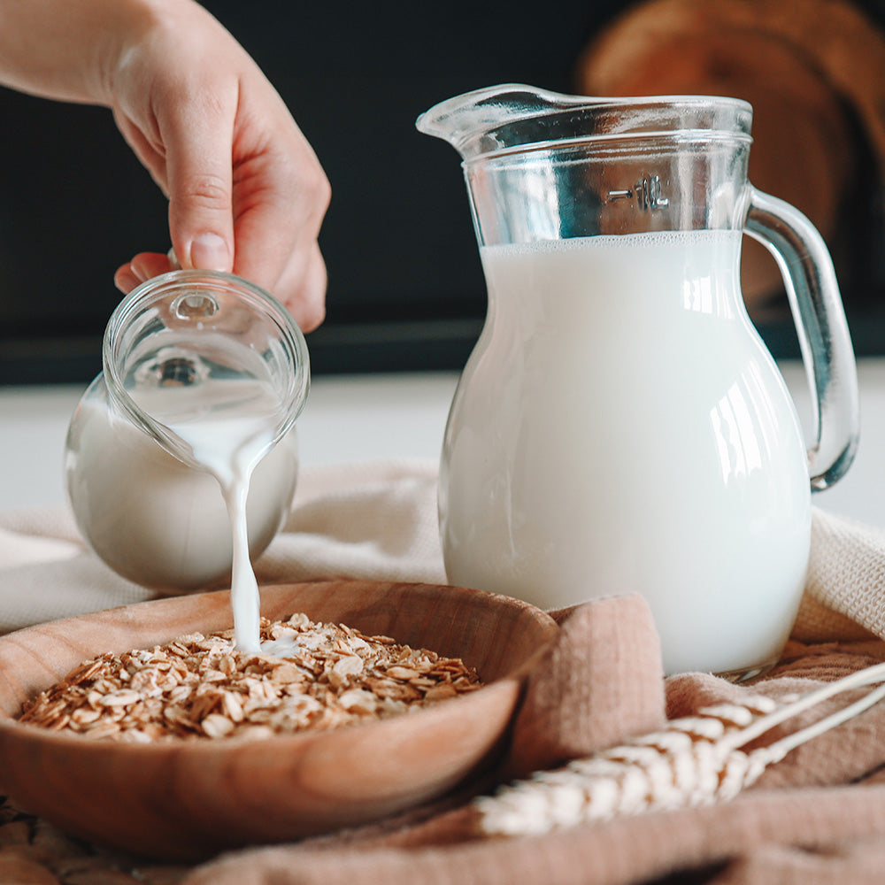 Emergency Essentials Nonfat Dry Milk being poured for cooking, baking, or everyday meal preparation