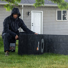 Grid Doctor backup power system being used outdoors near a home
