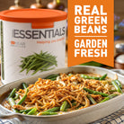 Casserole dish with green beans next to a container of green beans