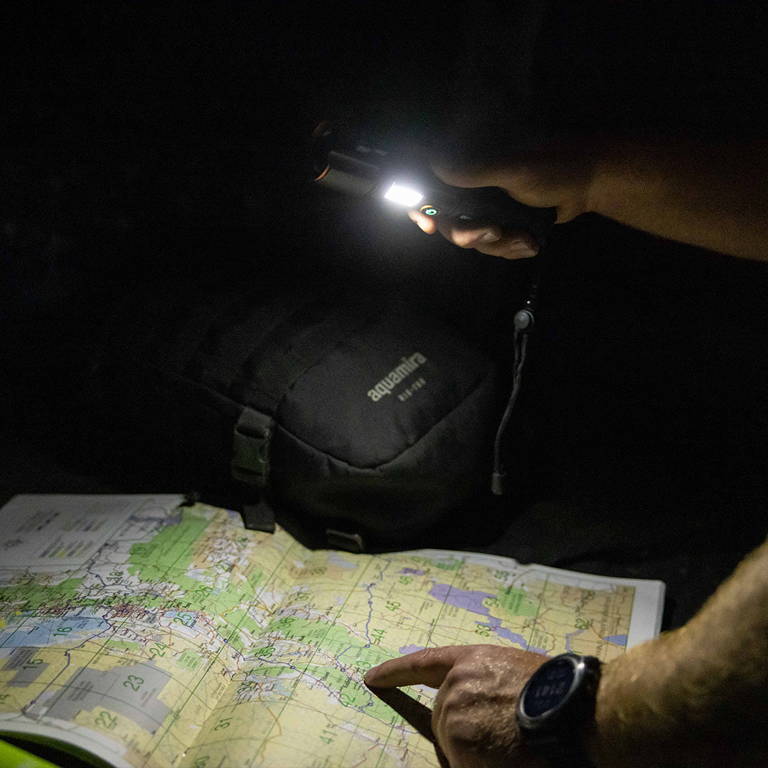 Tactical Flashlight by Grid Doctor illuminating a map