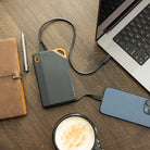 65W Power Bank by Grid Doctor plugged into laptop and phone